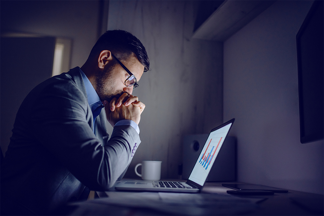 man worrying at computer